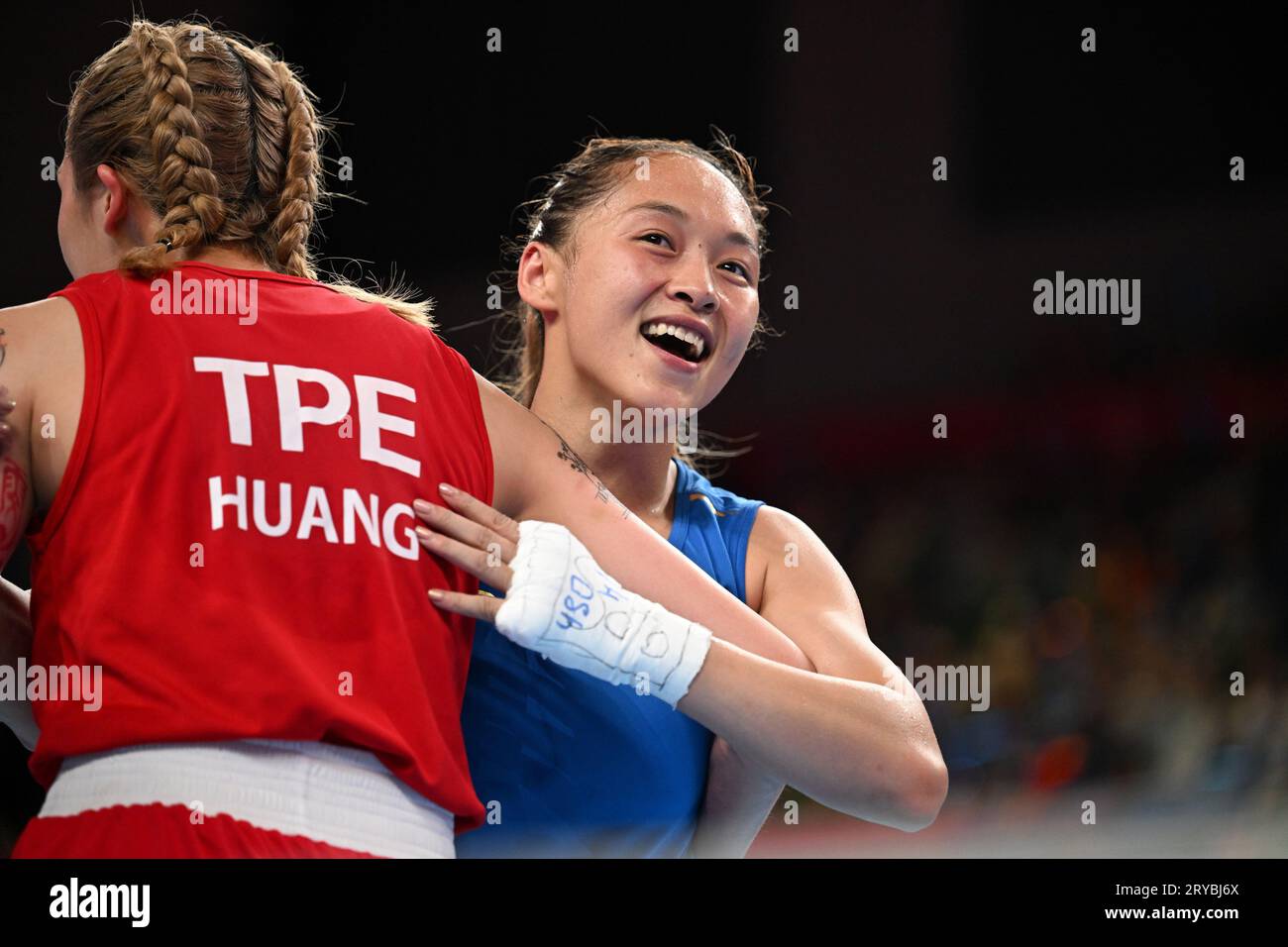 Hangzhou, China's Zhejiang Province. 30th Sep, 2023. Chang Yuan(R) of China hugs Huang Hsiao-Wen of Chinese Taipei after Boxing Women's 50-54Kg Quarterfinal at the 19th Asian Games in Hangzhou, east China's Zhejiang Province, Sept. 30, 2023. Credit: Zhan Yan/Xinhua/Alamy Live News Stock Photo