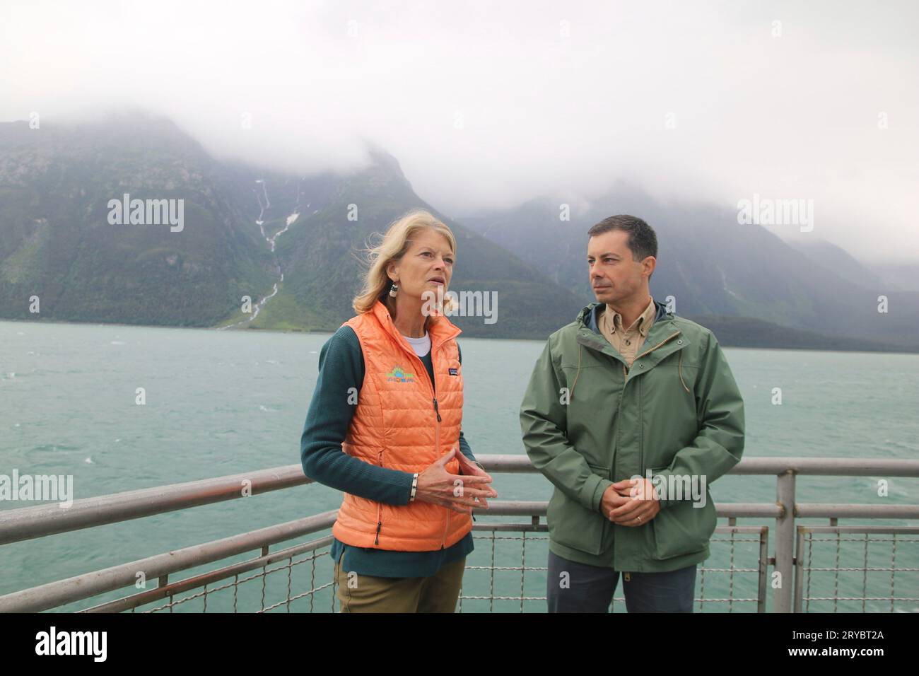 Juneau, United States of America. 18 August, 2023. U.S Secretary of Transportation Pete Buttigieg, right, listens to U.S Senator Lisa Murkowski, R-AK, during a journey on the ferry Hubbard down the Lynn Canal, August 18, 2023 near Juneau, Alaska. The Alaska Marine Highway System will receive more than $286 million from the federal government which is more than three times the size of the ferry system’s annual budget.  Credit: USDOT/US Department of Transportation/Alamy Live News Stock Photo
