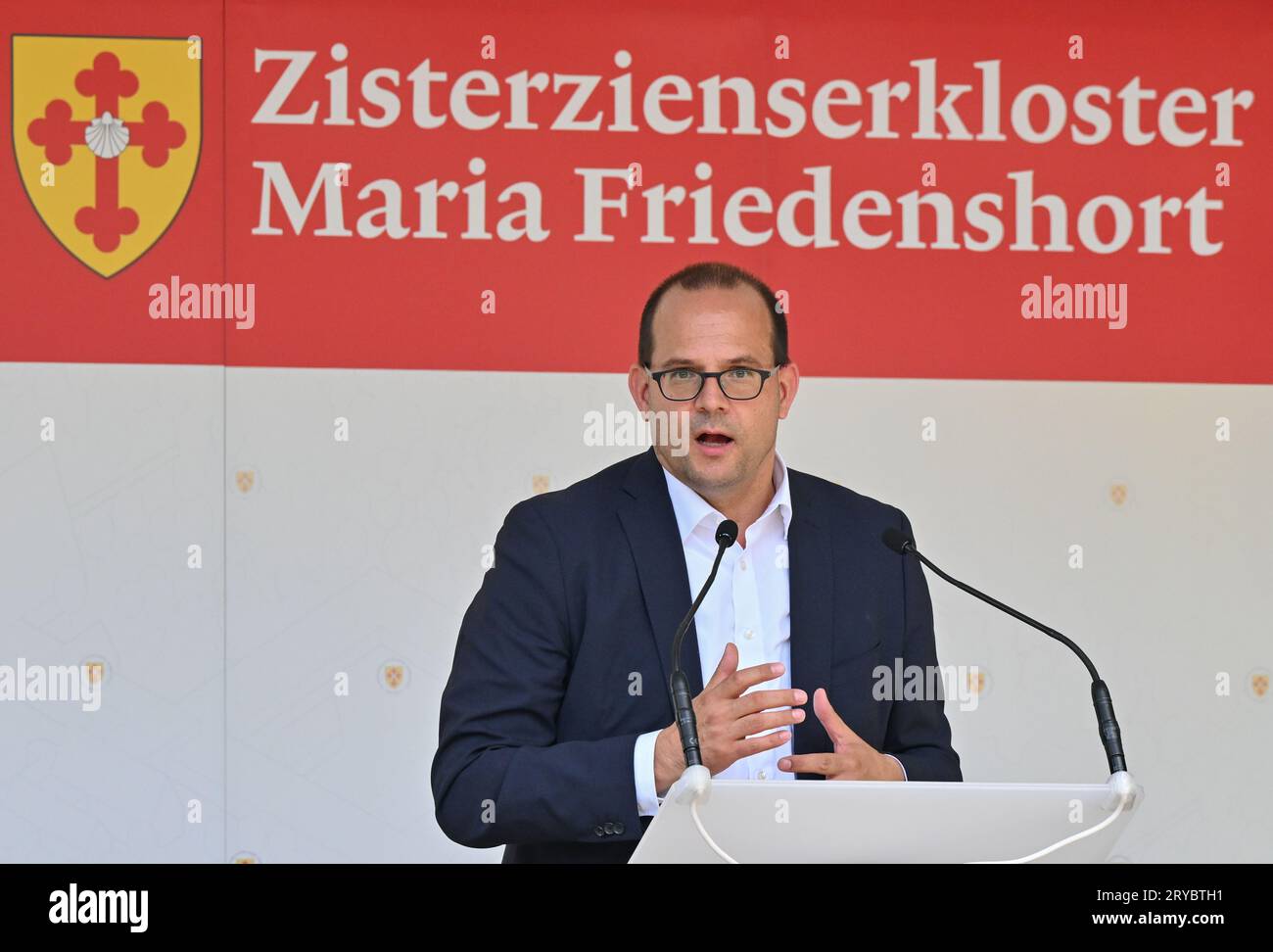 30 September 2023, Brandenburg, Treppeln: Tobias Dünow, State Secretary for Culture of Brandenburg, speaks at the thanksgiving festival at the future site of the Cistercian monastery Maria Friedenshort. With a thanksgiving festival on Saturday, the Cistercians celebrated in a forest near Treppeln (Oder-Spree) that they are the owners of a new plot of land there. The first monastery of the religious community in Brandenburg since the Middle Ages is to be built on the site. Photo: Patrick Pleul/dpa Stock Photo