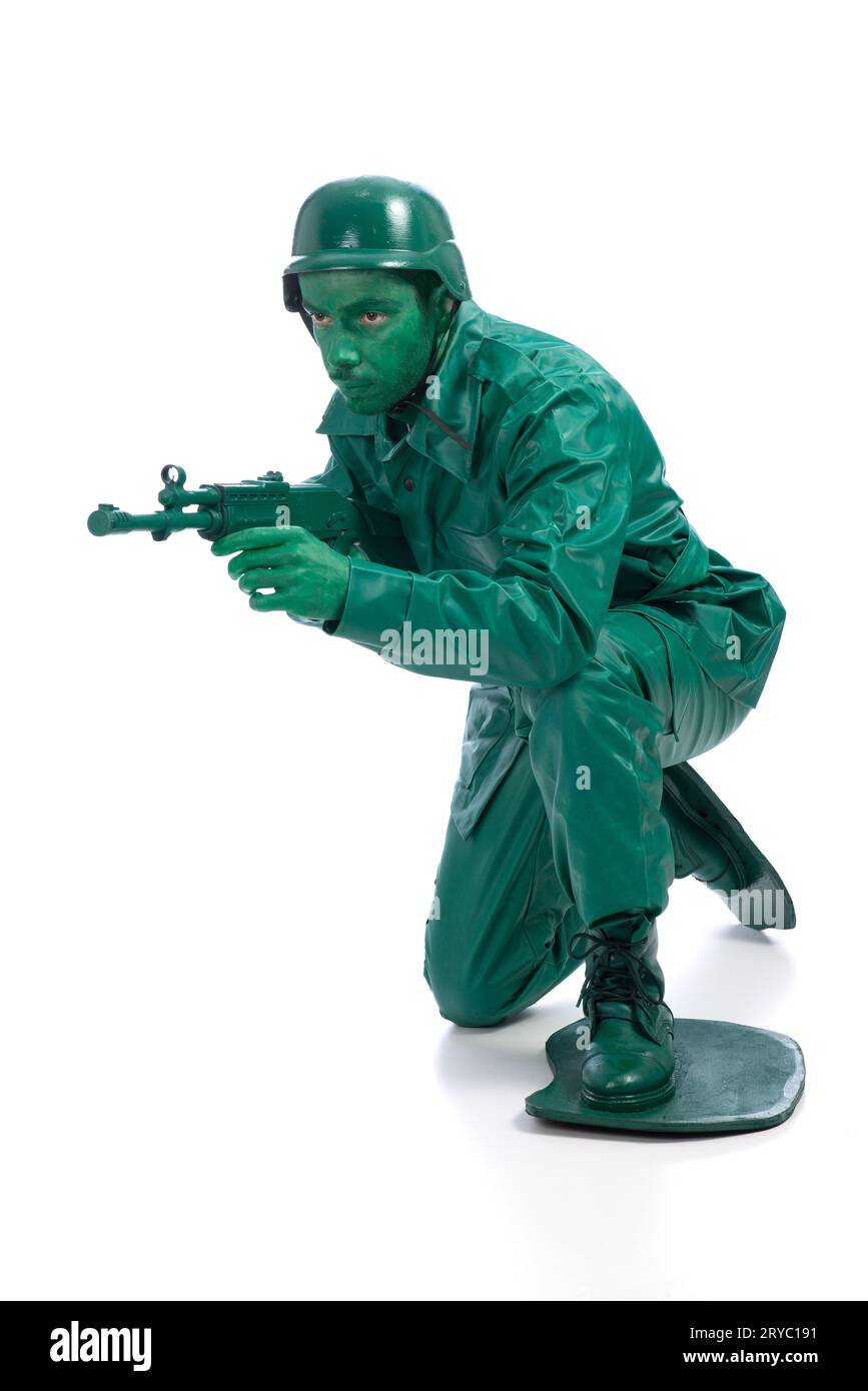 Man on a green toy soldier costume Stock Photo