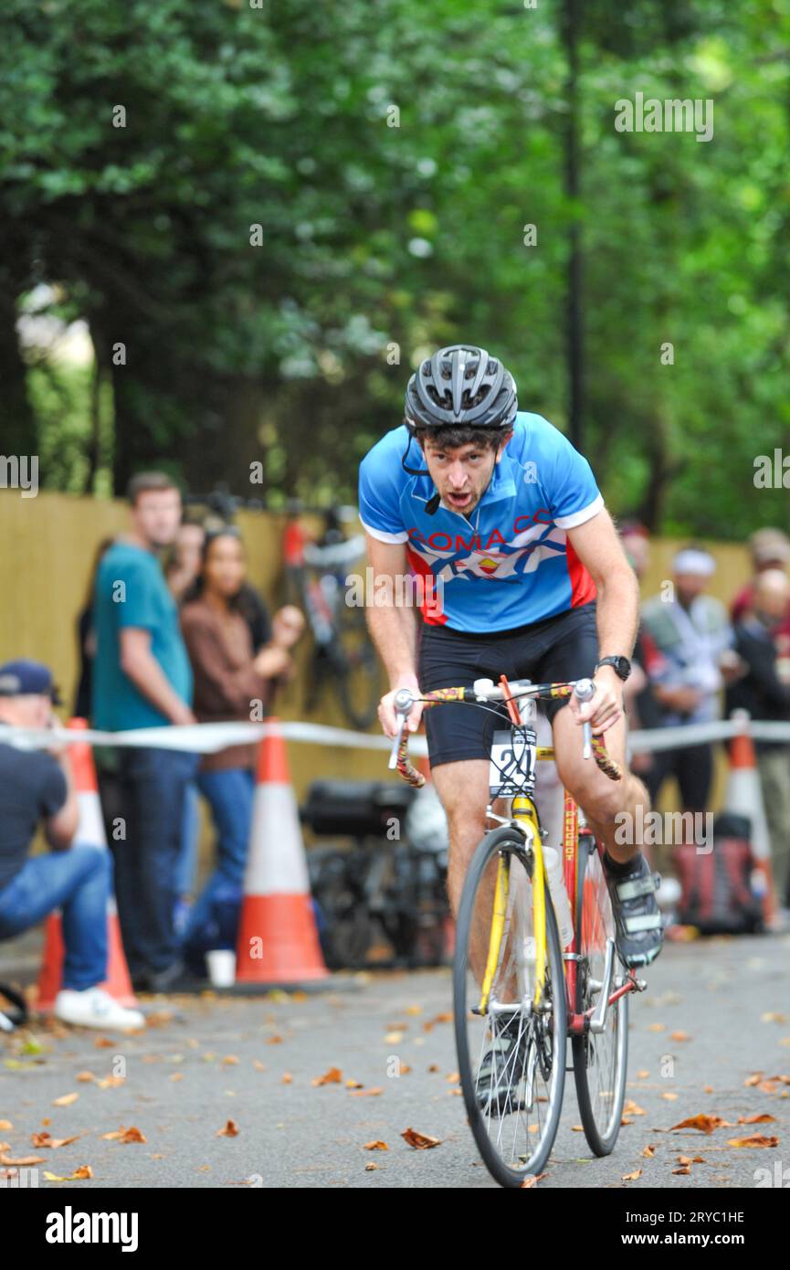 Cyclists strain as they race up Swains Lane, Highgate, London, UK in