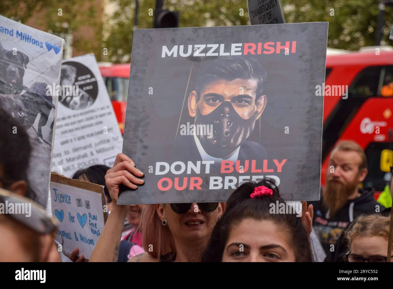 London, England, UK. 30th Sep, 2023. A protester holds a 'Muzzle Rishi Sunak' placard outside Downing Street. Dog owners marched in Westminster in protest against the American Bully XL ban and Breed Specific Legislation (BSL), and demanded justice for Marshall and Millions, two dogs killed by police officers. (Credit Image: © Vuk Valcic/ZUMA Press Wire) EDITORIAL USAGE ONLY! Not for Commercial USAGE! Stock Photo