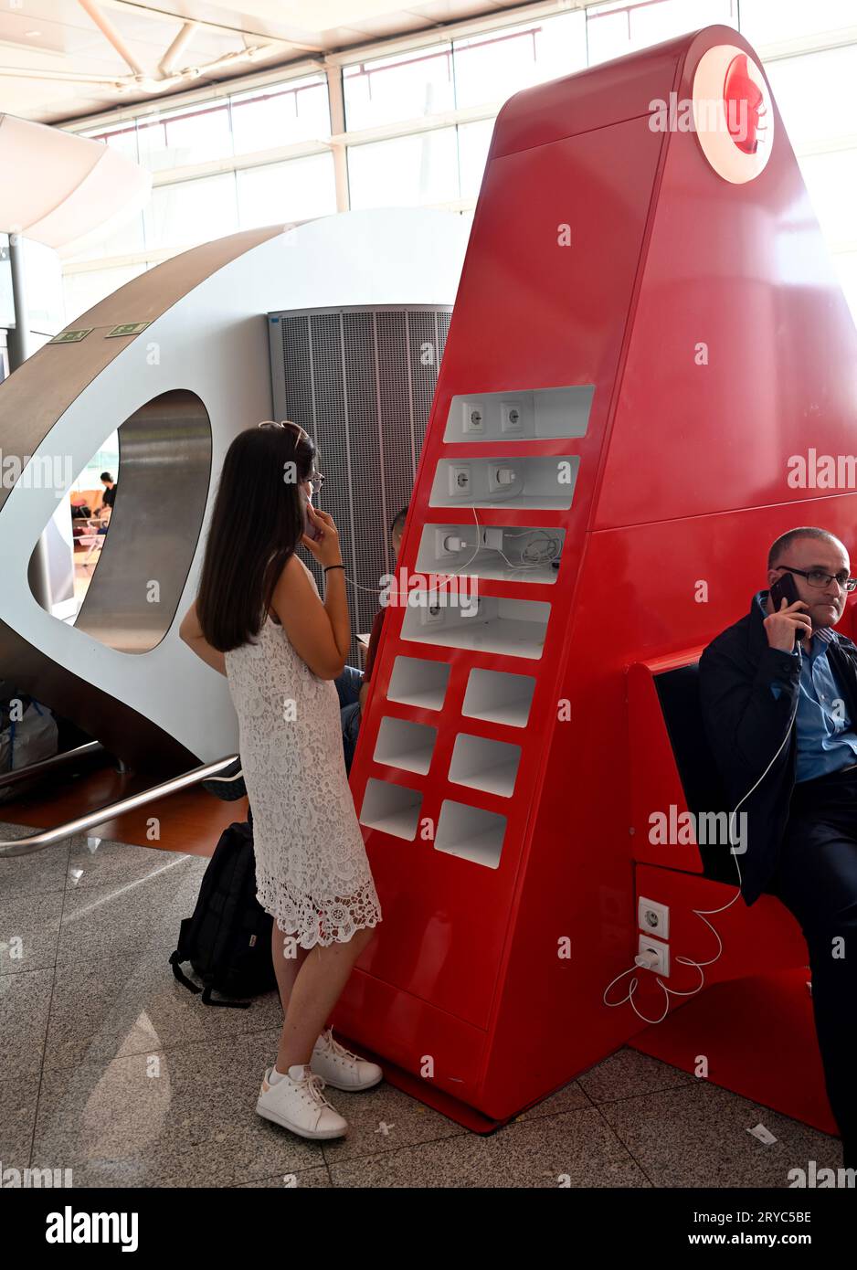 Public phone charging station in airport Stock Photo Alamy