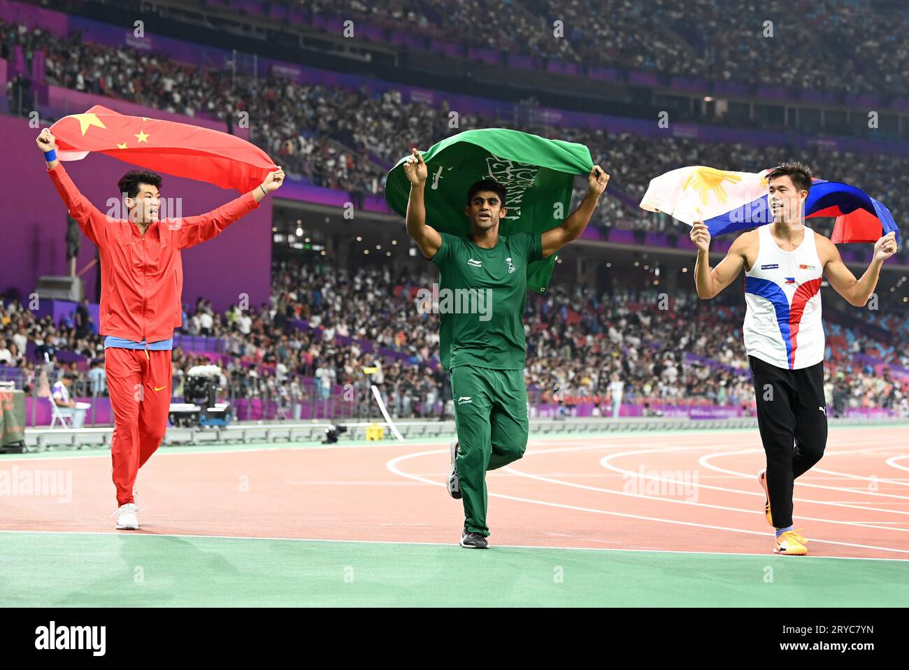 Hangzhou, China's Zhejiang Province. 30th Sep, 2023. Ernest John Obiena (R) of the Philippines, Huang Bokai (L) of China and Hussain Asim M Al Hizam of Saudi Arabia celebrate after the Men's Pole Vault of Athletics at the 19th Asian Games in Hangzhou, east China's Zhejiang Province, Sept. 30, 2023. Credit: Jiang Han/Xinhua/Alamy Live News Stock Photo