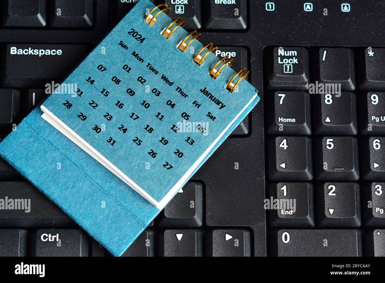 Blue January 2024 calendar on keyboard. 2024 New Year Concept Stock