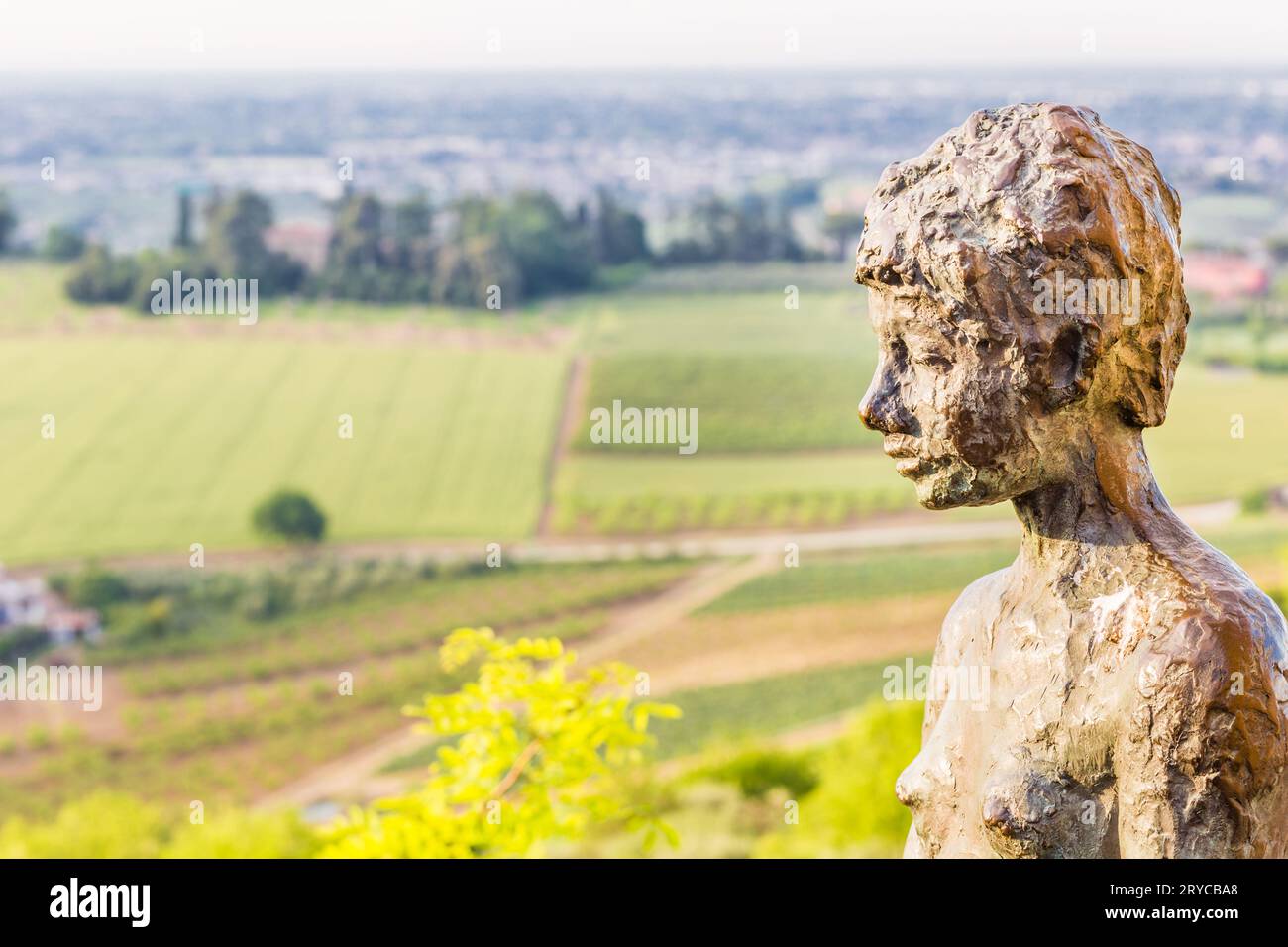 The statue of the boy sitting in Longiano Stock Photo