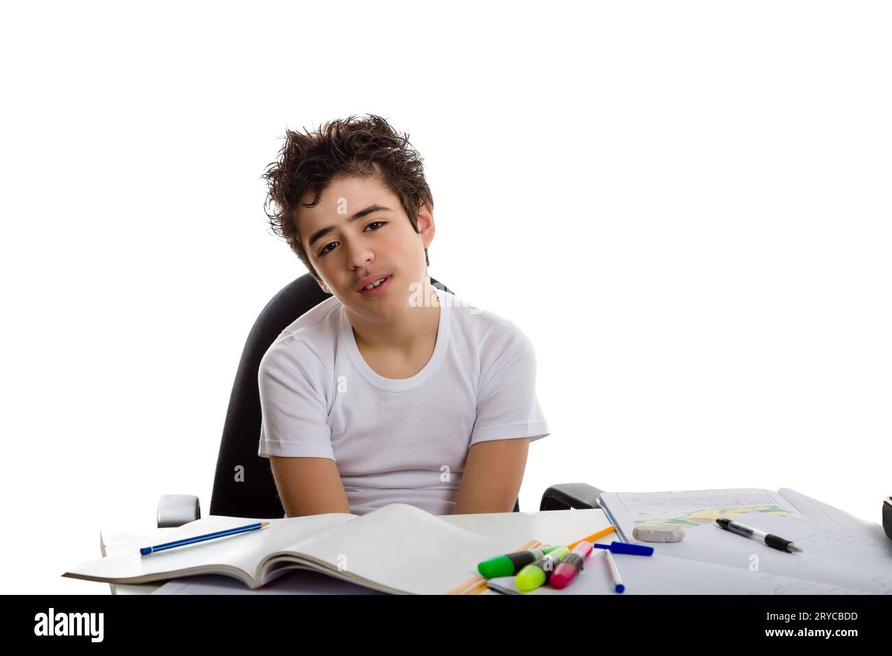 Tired boy doing homework Stock Photo
