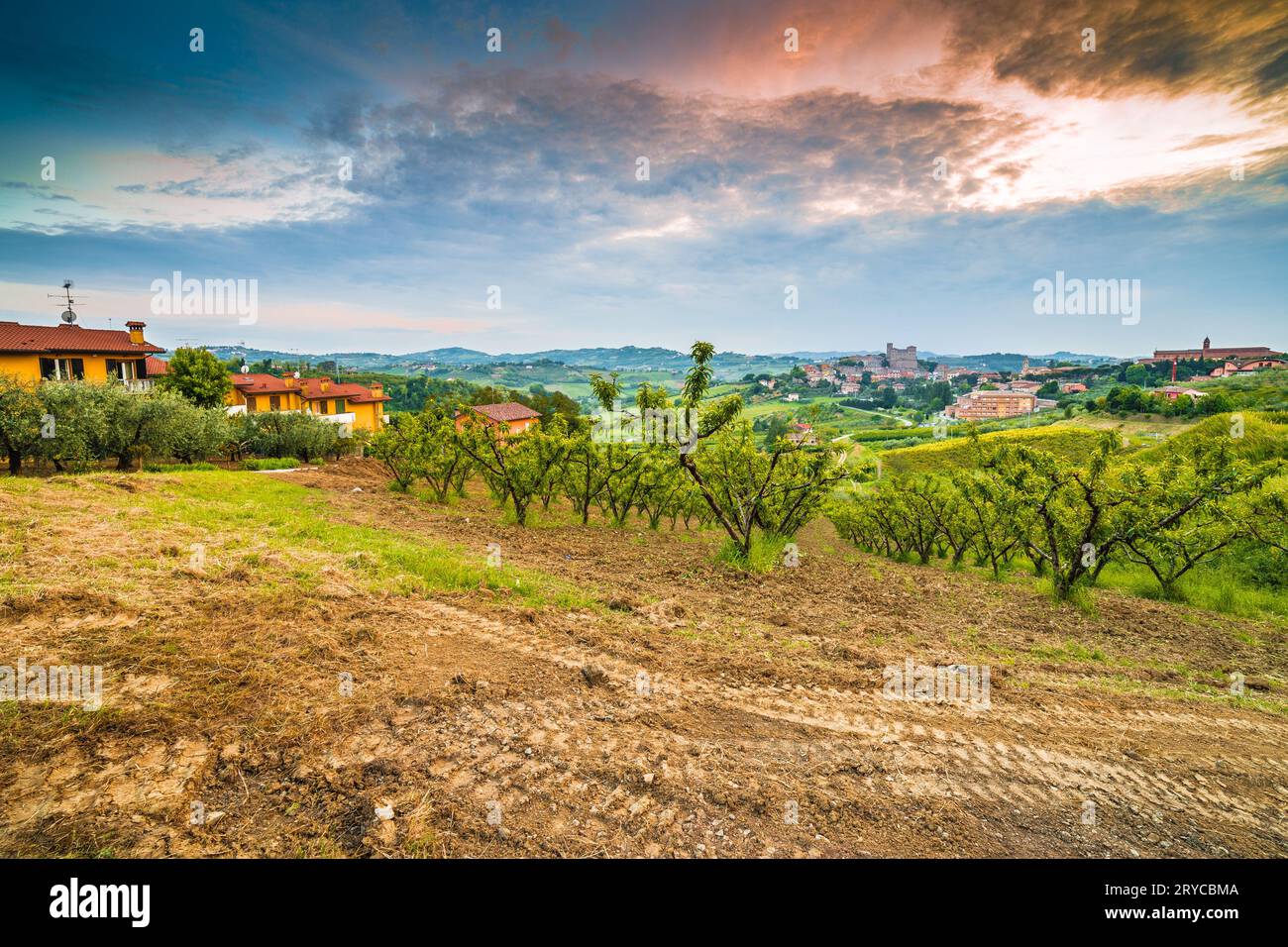 Plowed field in countryside around a medieval castle Stock Photo