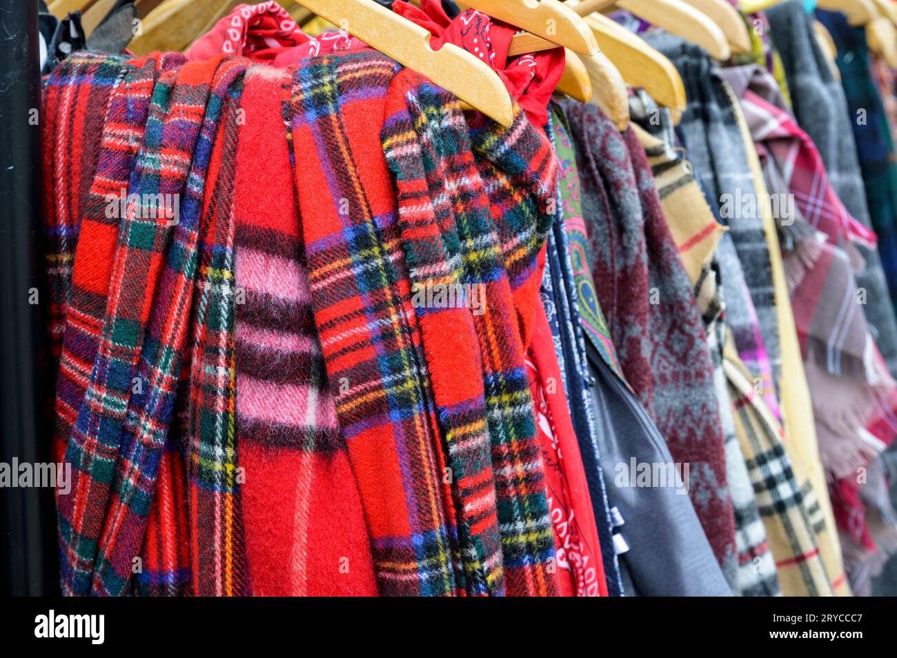 Tartan scarfs for sale in a thrift shop Stock Photo