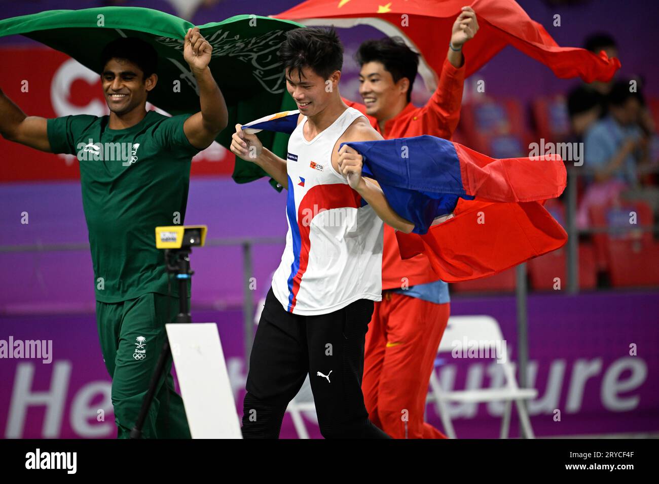 Hangzhou, China's Zhejiang Province. 30th Sep, 2023. Huang Bokai of China(R), Ernest John Obiena(C) of the Philippines and Hussain Asim M Al Hizam of Saudi Arabia react after the Men's Pole Vault of Athletics at the 19th Asian Games in Hangzhou, east China's Zhejiang Province, Sept. 30, 2023. Credit: Song Yanhua/Xinhua/Alamy Live News Stock Photo