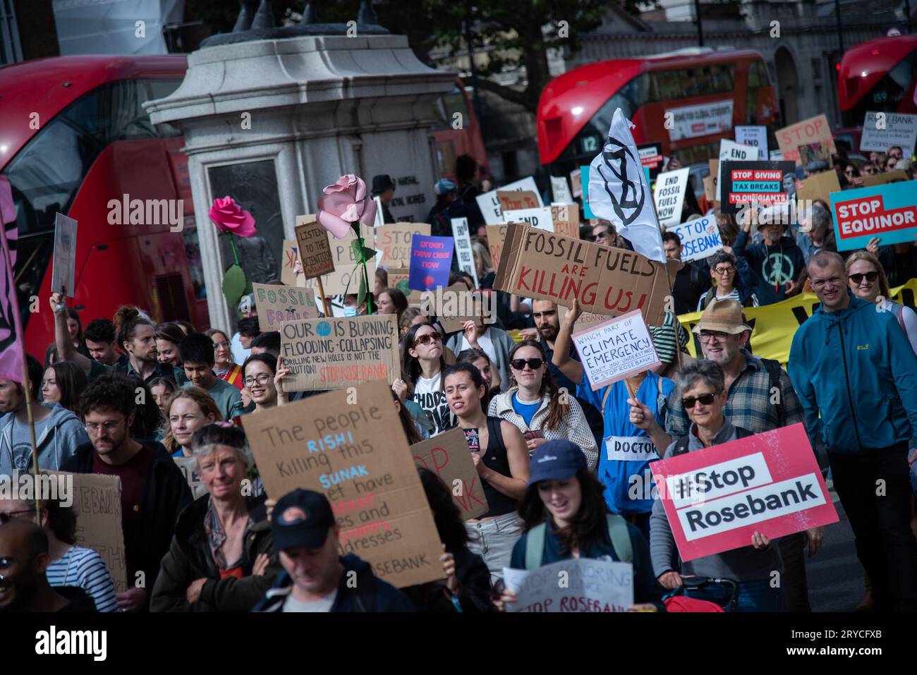 London, UK. 30th Sep, 2023. A crowd of protestors march with placards ...