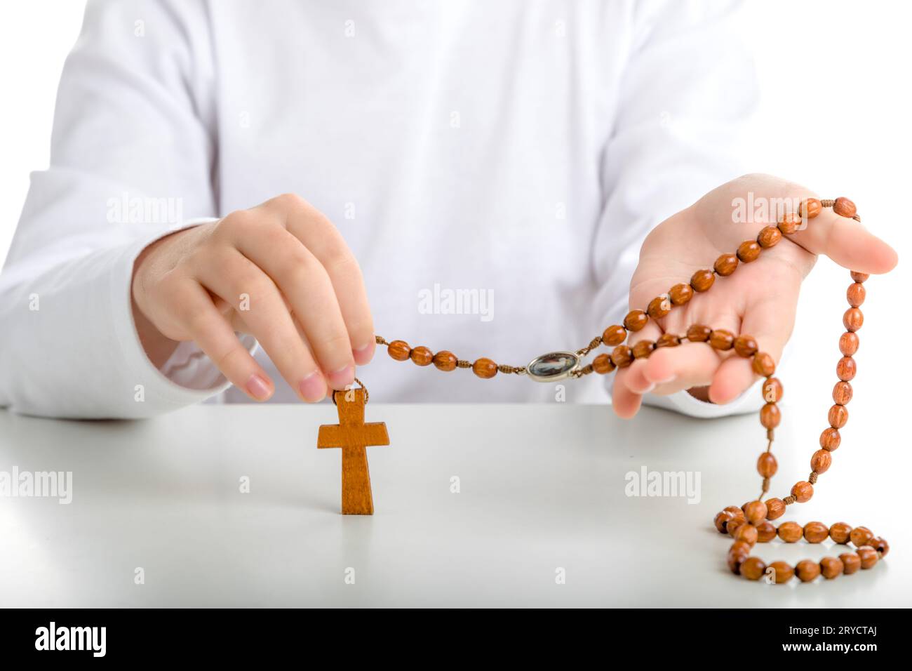 Hands holding rosary beads cross hi-res stock photography and images ...