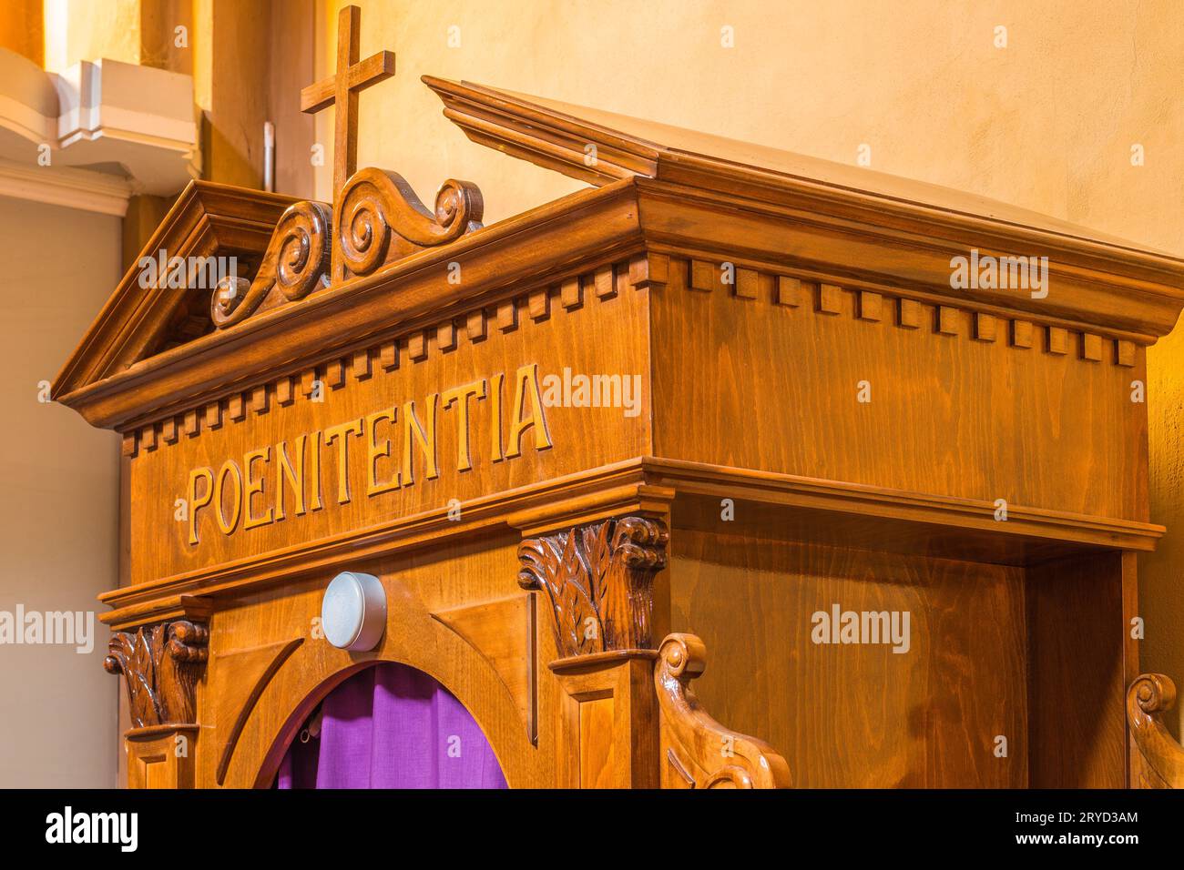 Latin word on a wooden confessional Stock Photo