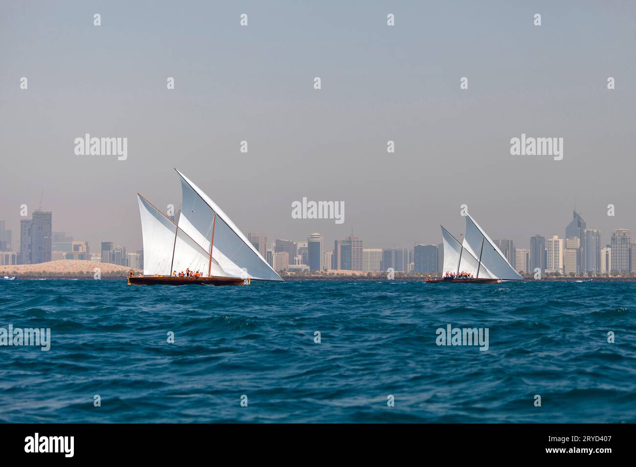 Traditional sailing dhows race back to Abu Dhabi at Ghanada Dhow Sailing Race 60 ft. Final Round Stock Photo