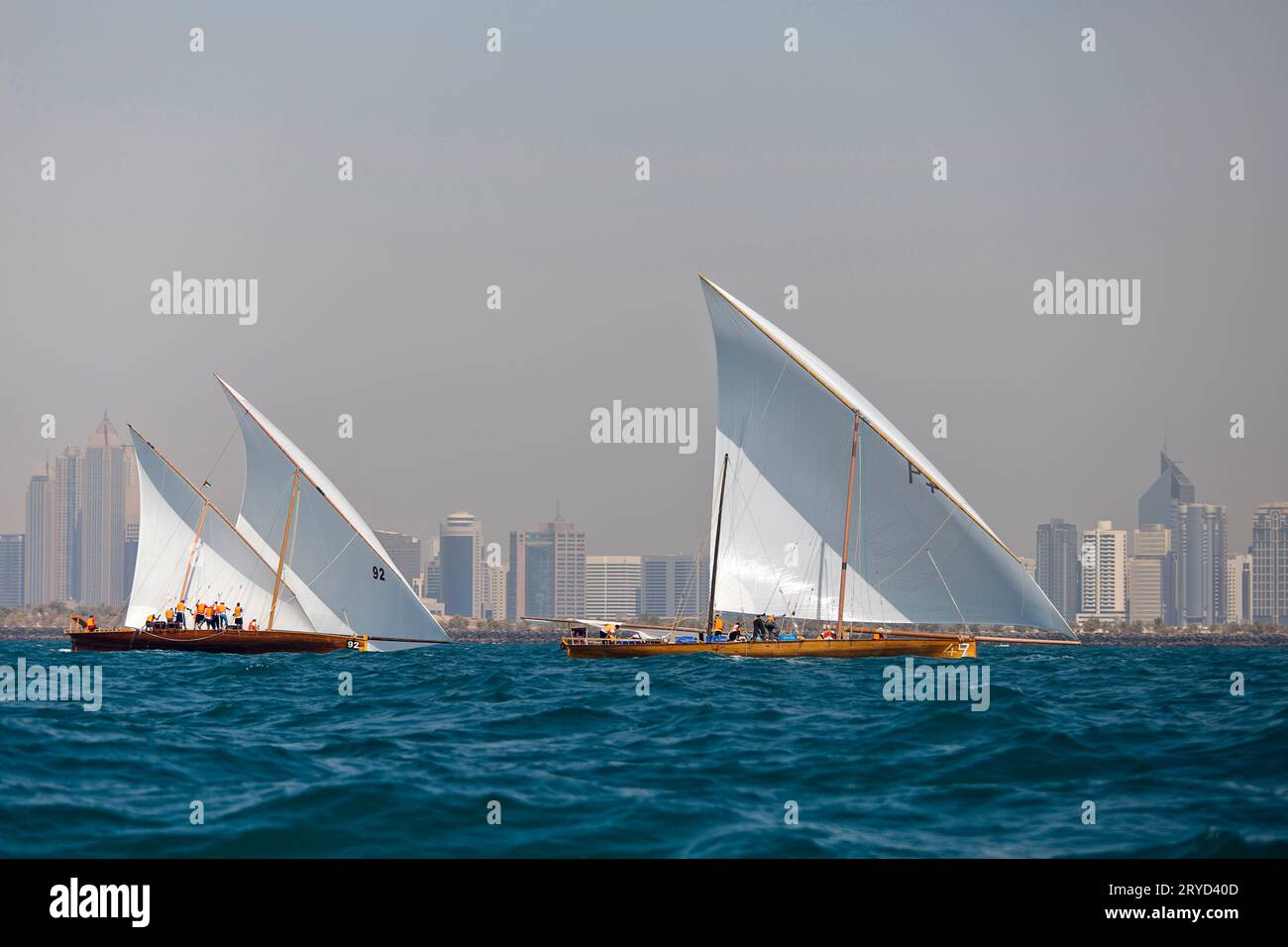 Traditional sailing dhows race back to Abu Dhabi at Ghanada Dhow Sailing Race 60 ft. Final Round Stock Photo