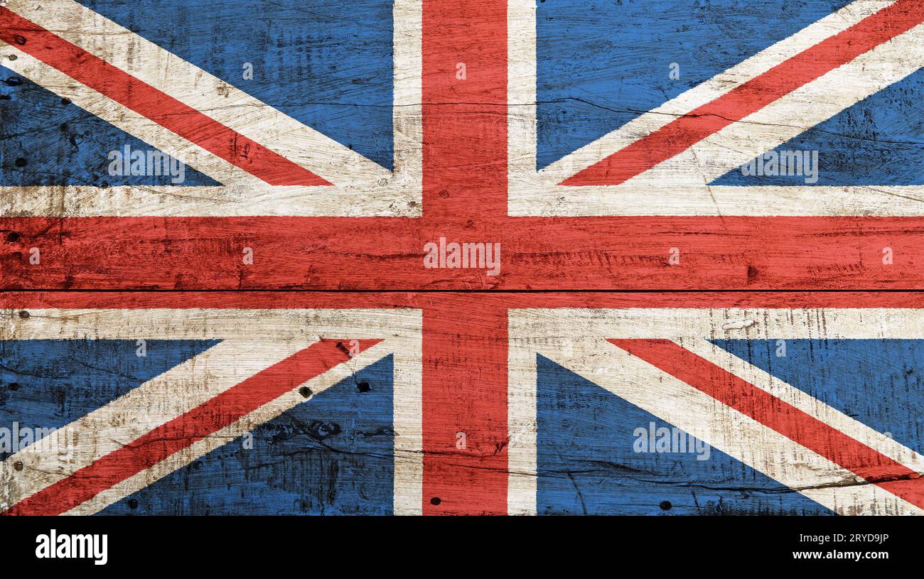 Old vintage UK British flag over white wood Stock Photo