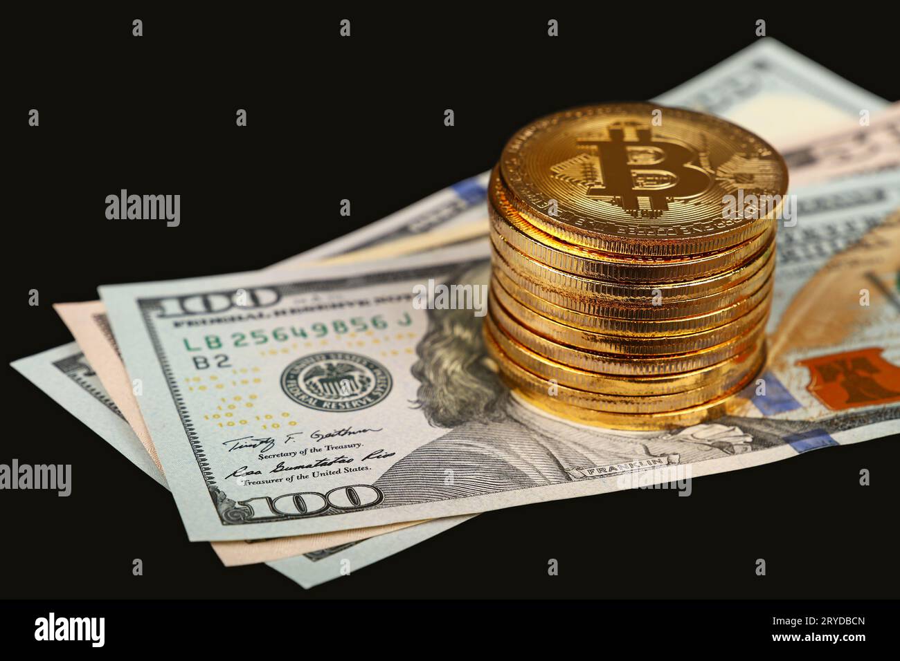 Bitcoin gold coins on US dollar bills. The concept of a peer-to-peer  payment system that uses the same unit for accounting transactions Stock  Photo - Alamy