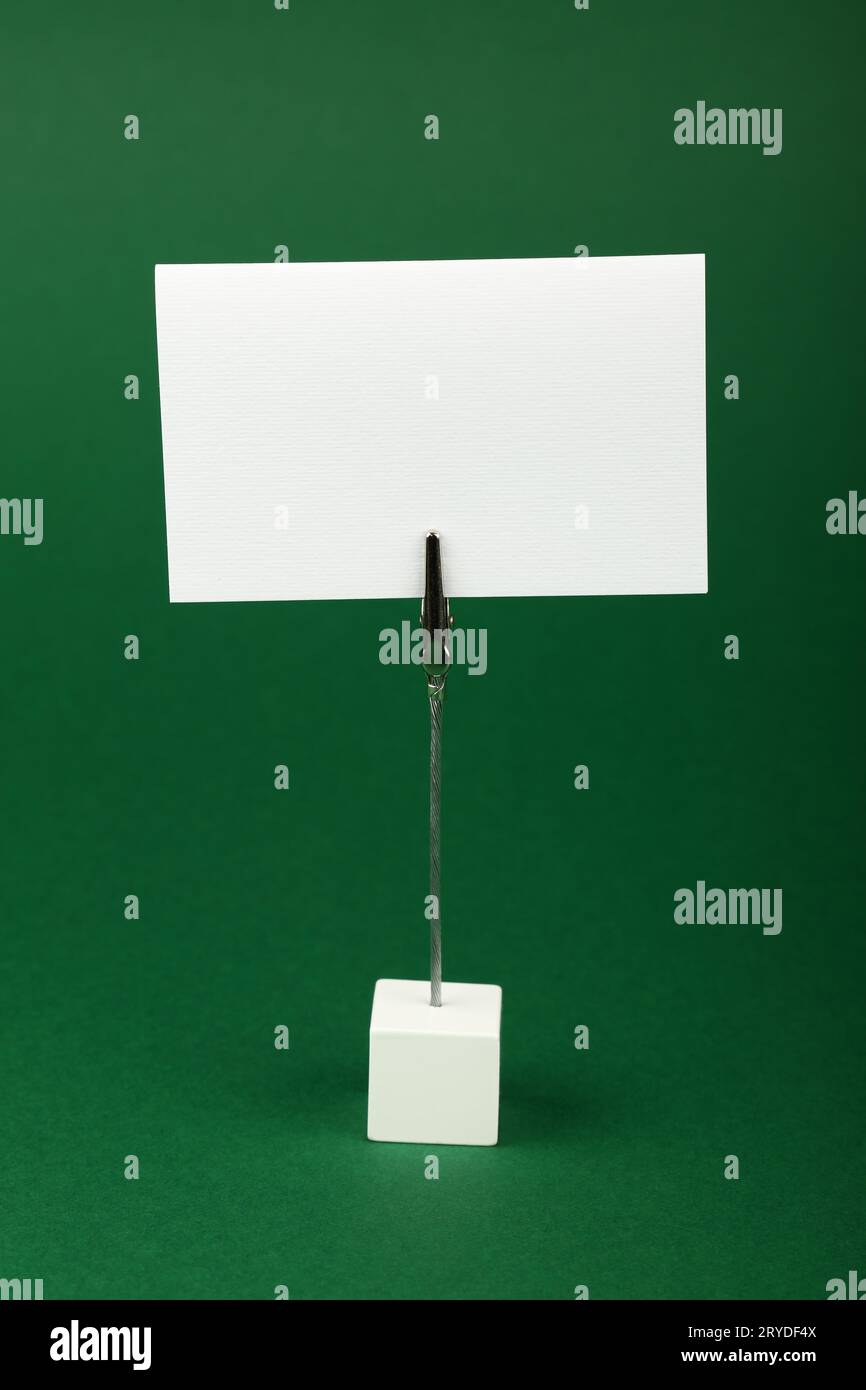 Blank white paper sign over green background Stock Photo