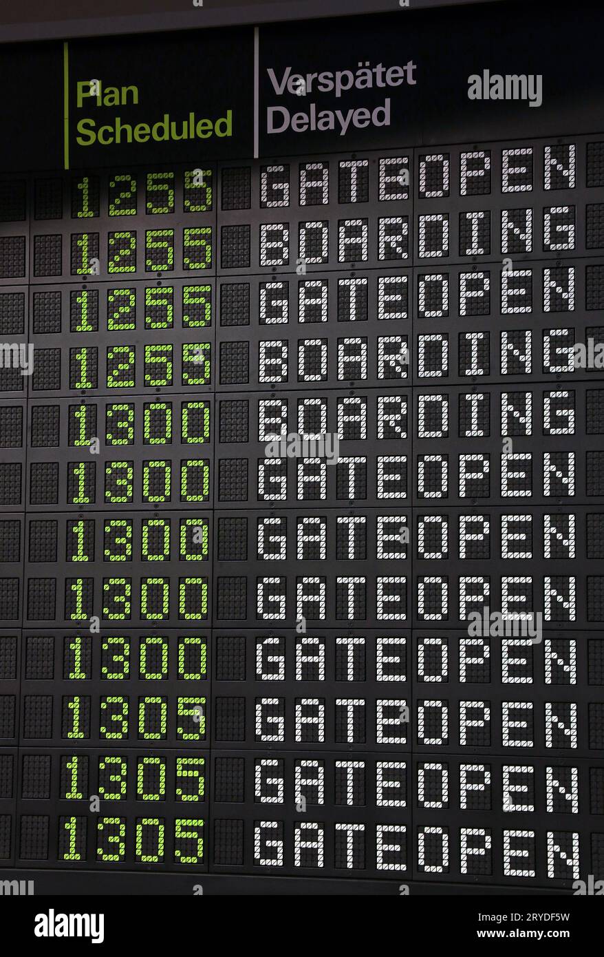 Flight information panel at airport Stock Photo