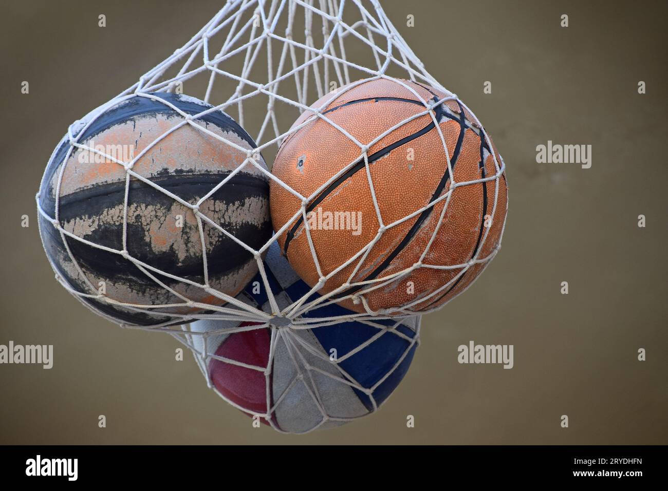 Three old vintage basketball balls in mesh sack Stock Photo Alamy