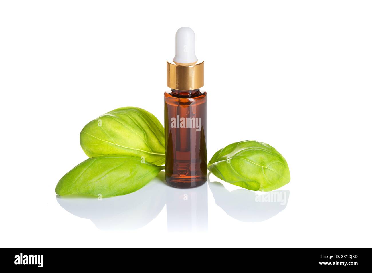 Basil essential oil isolated on white background Stock Photo