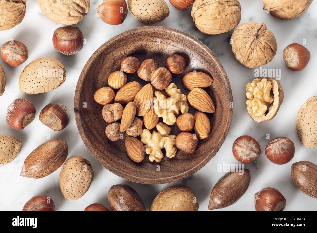 Nuts Mixed in a wooden plate Stock Photo