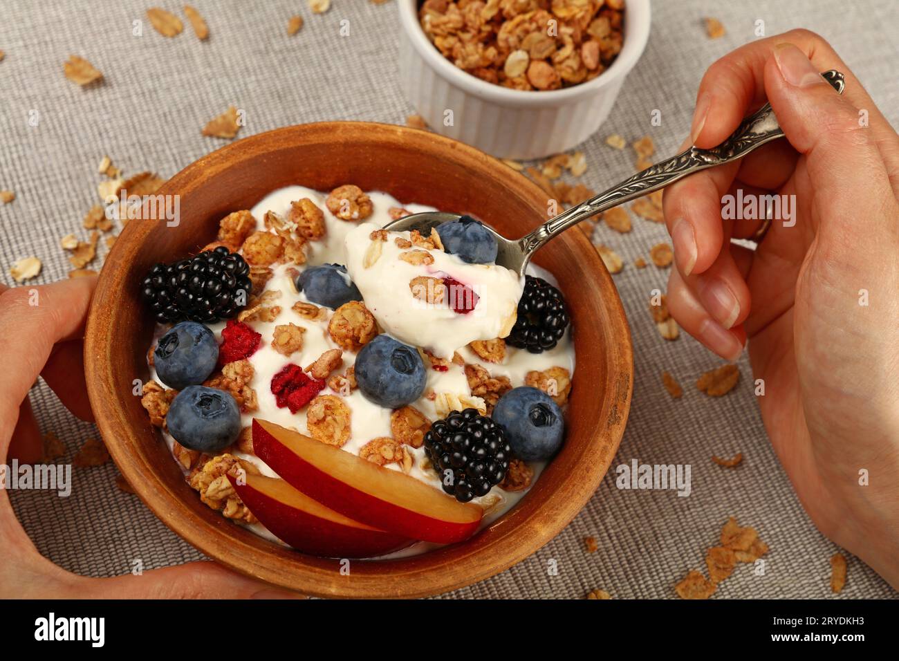 Woman eating muesli granola breakfast with yogurt Stock Photo Alamy