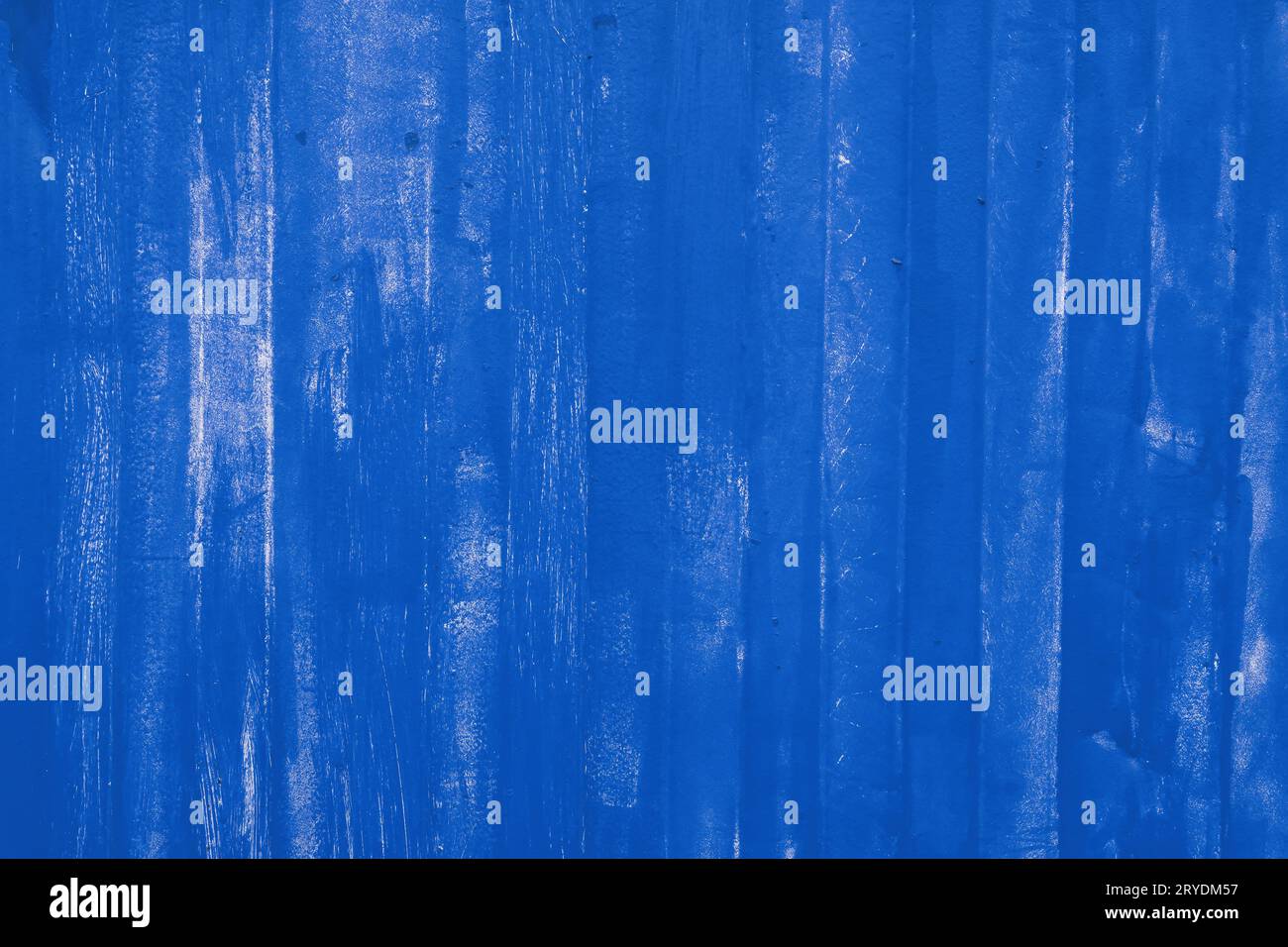 Blue painted uneven metal wall surface close up Stock Photo