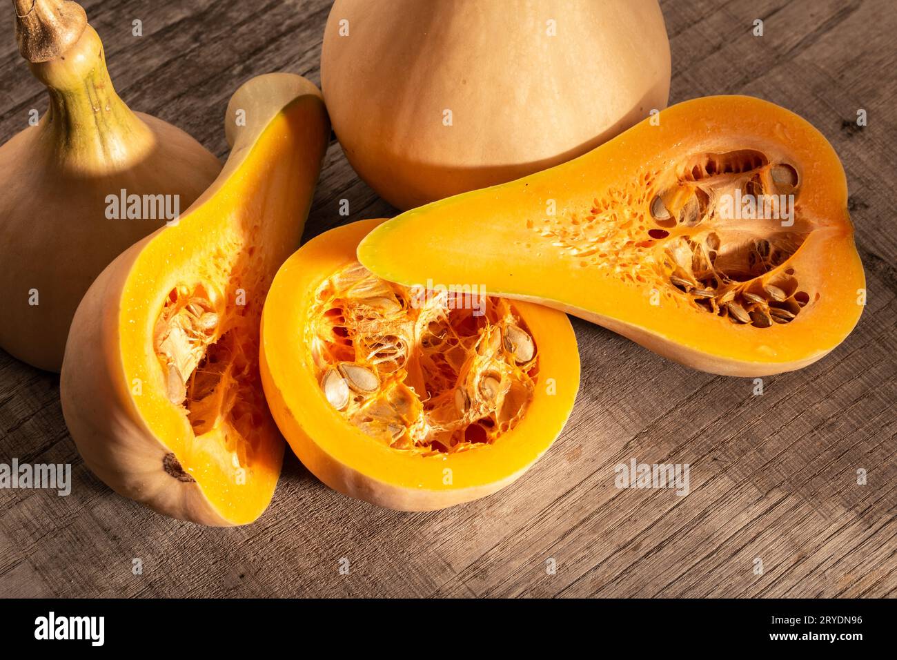 Fresh butternut squash on rustic wooden table Stock Photo