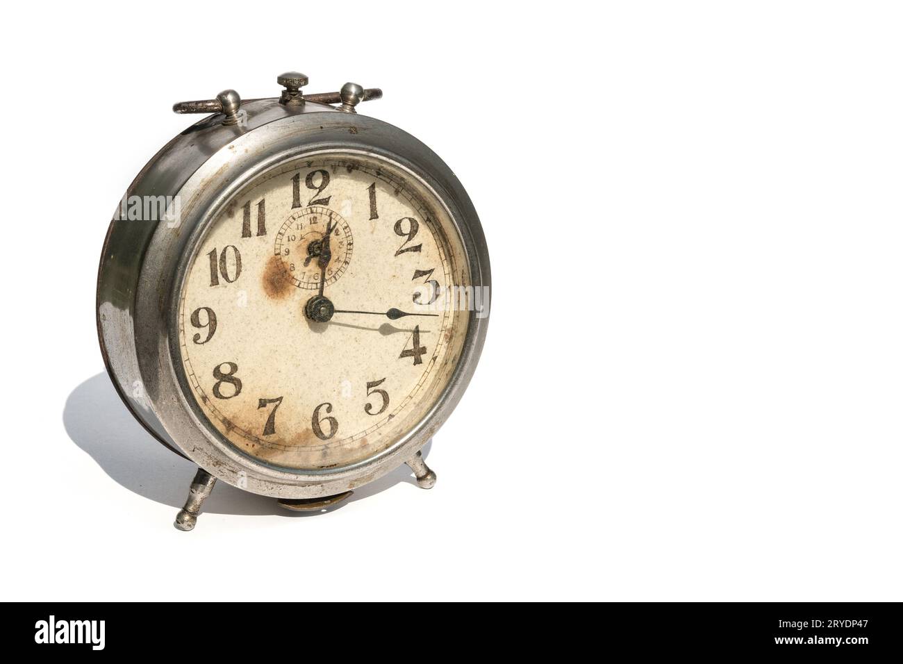 Old alarm clock isolated on white background Stock Photo - Alamy