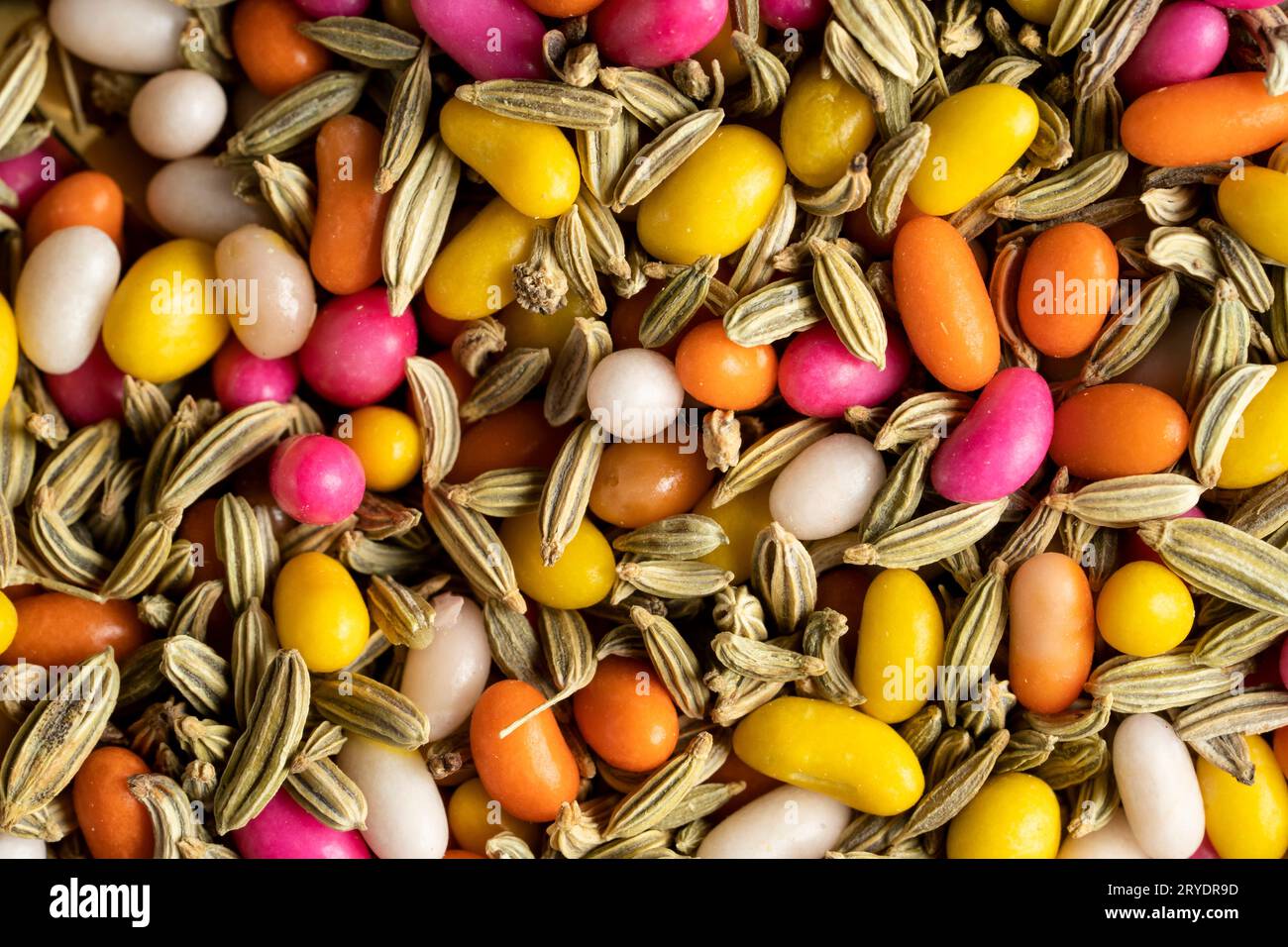 A closeup of mukhwas mouth freshener, mix of fennel seeds raw and coloured Stock Photo Alamy