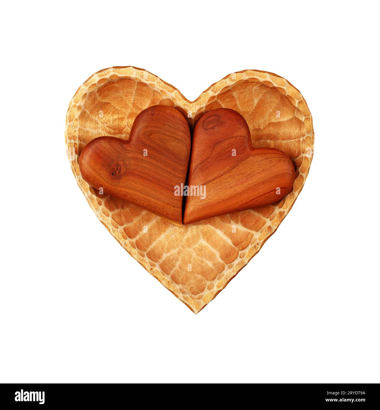 Two brown wooden hearts in bowl isolated on white Stock Photo