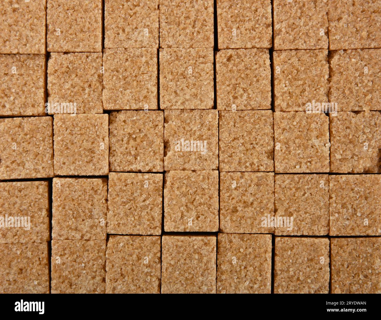 Background texture pattern of brown sugar cubes Stock Photo