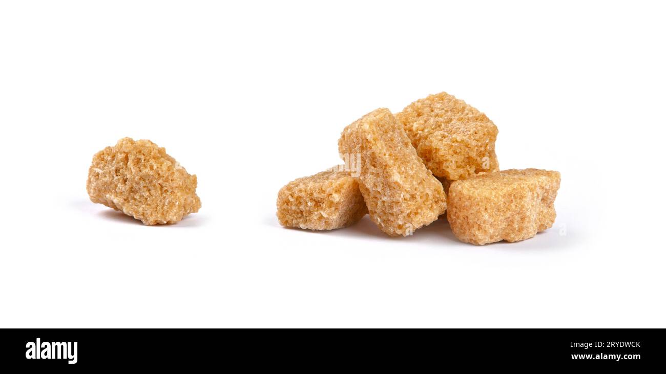 Close up brown sugar cubes isolated on white Stock Photo