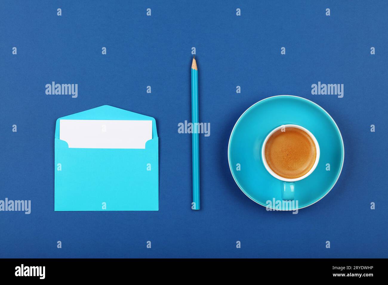 Blue paper letter envelope and coffee cup Stock Photo Alamy