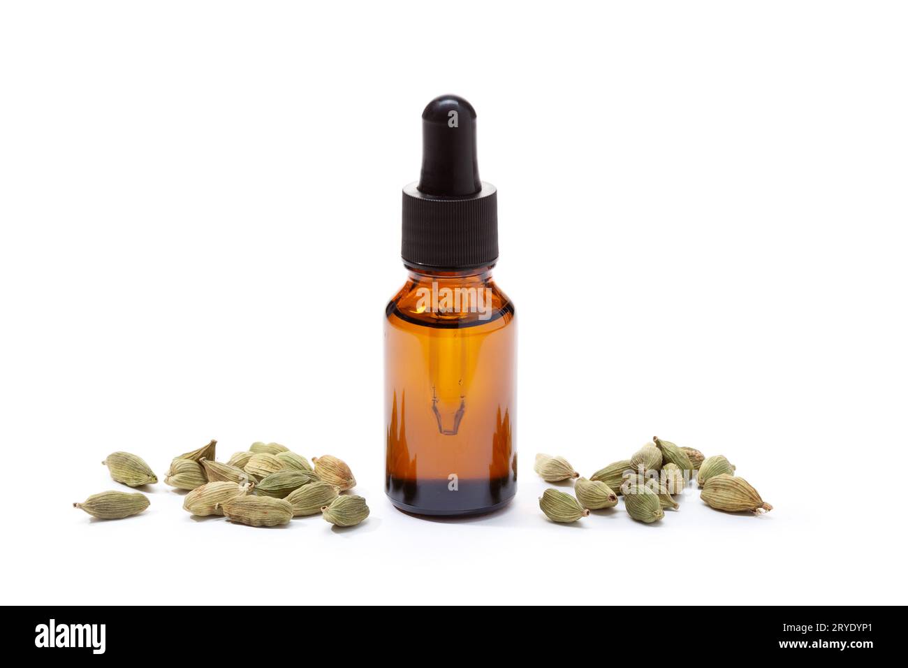 Cardamom essential oil in amber bottle isolated on white background Stock Photo