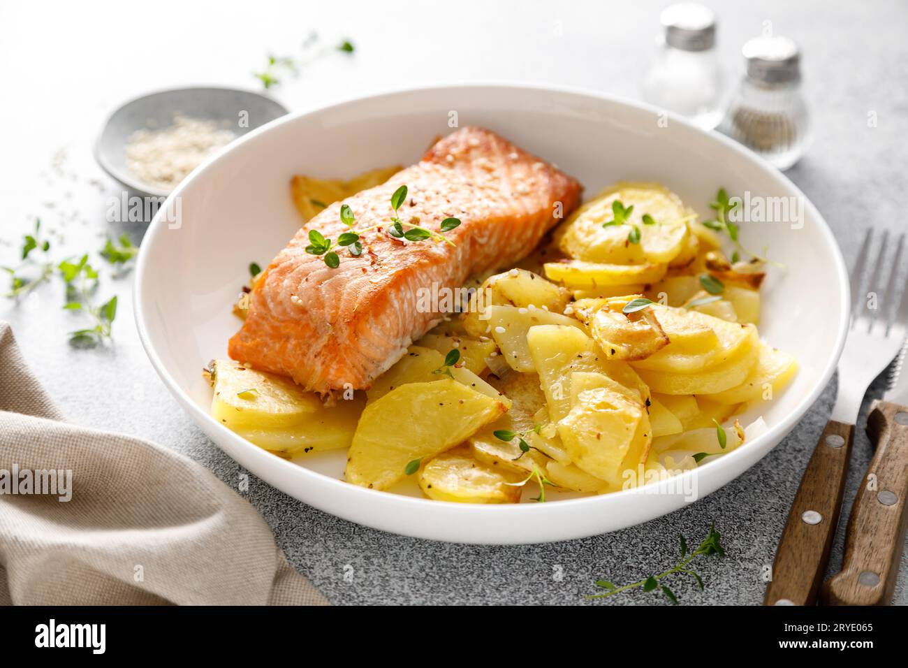 Salmon grilled and baked potato with onions Stock Photo