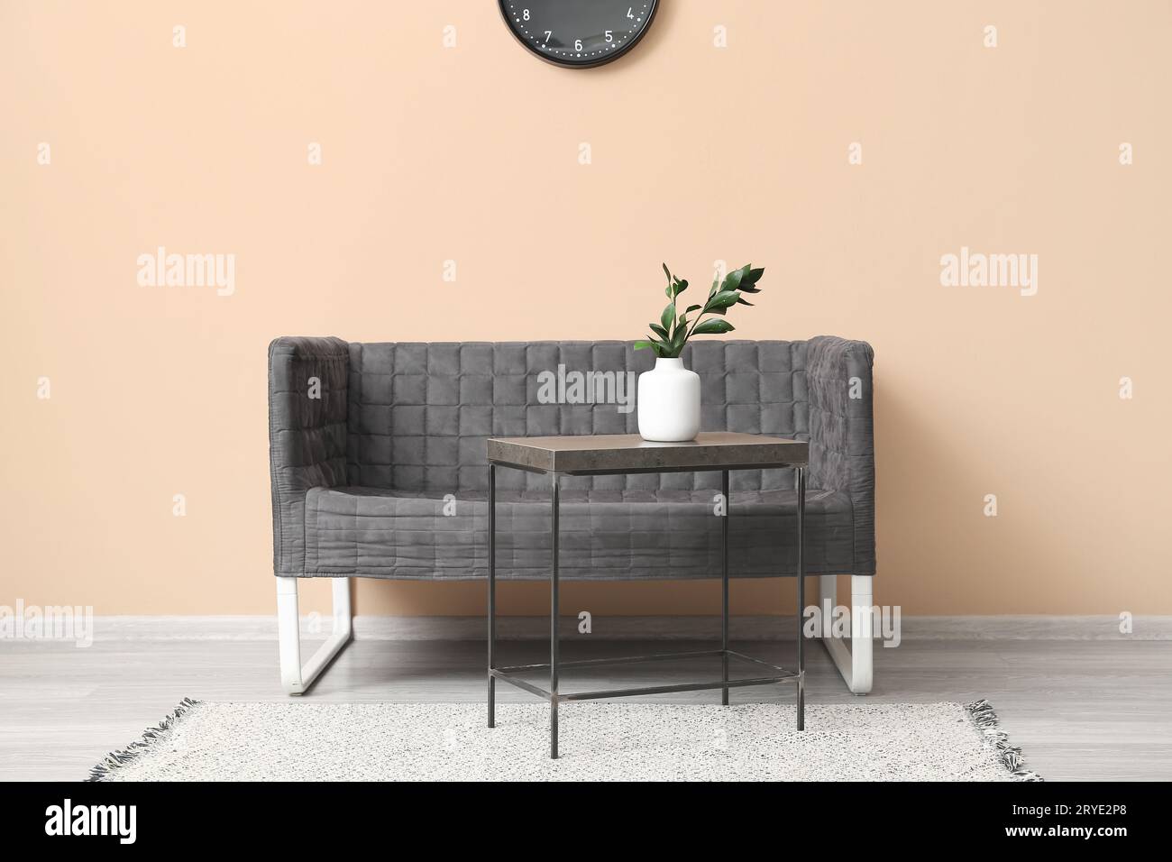 Interior of living room with black sofa and table Stock Photo - Alamy