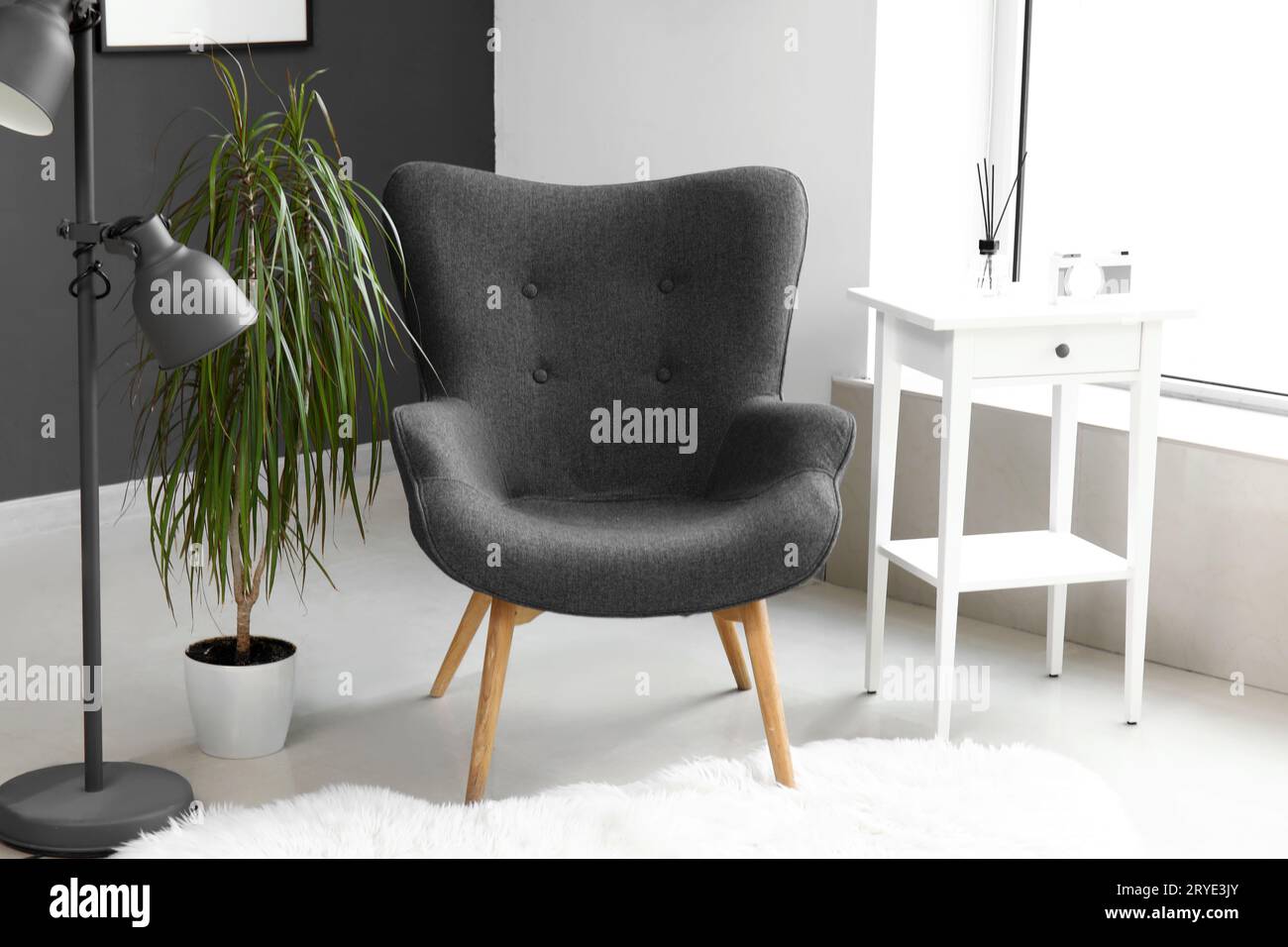 Interior of modern living room with black armchair and table Stock ...