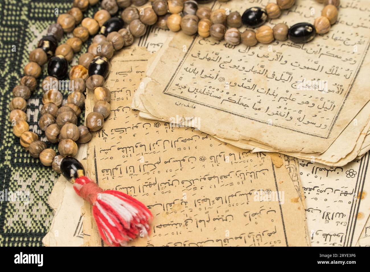 Muslim prayer beads with ancient pages from the Koran. Islamic and