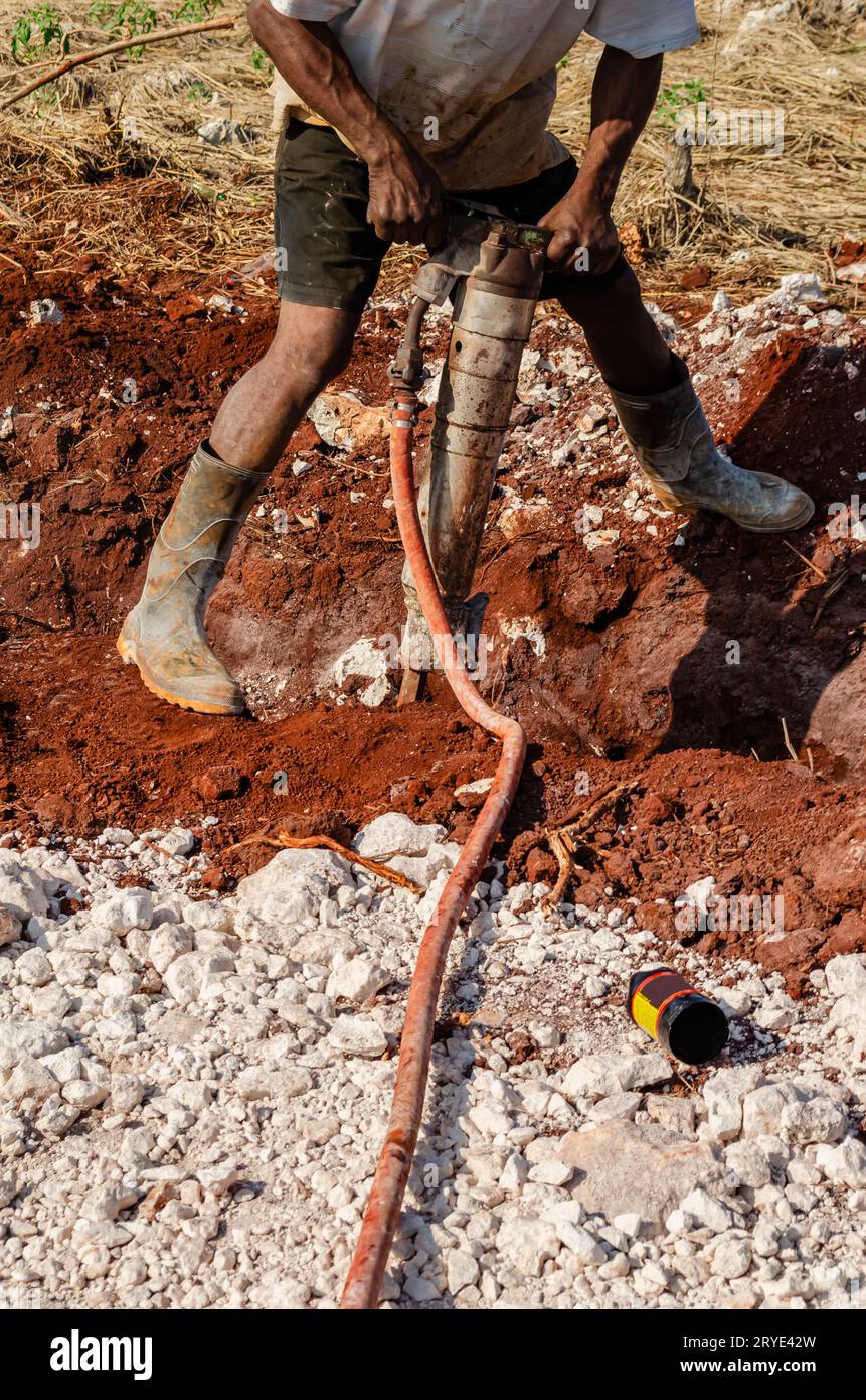 Hammer breaking rock hires stock photography and images Alamy