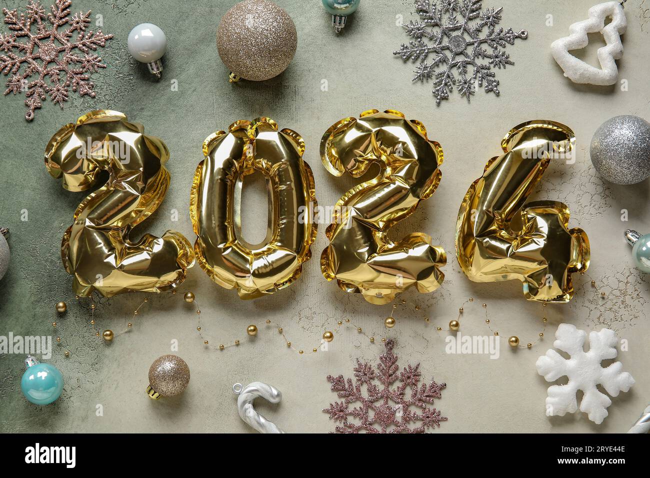 New Year 2024 celebration. Golden Yellow foil color balloons. 2024 balloons.  On Yellow background Stock Photo - Alamy