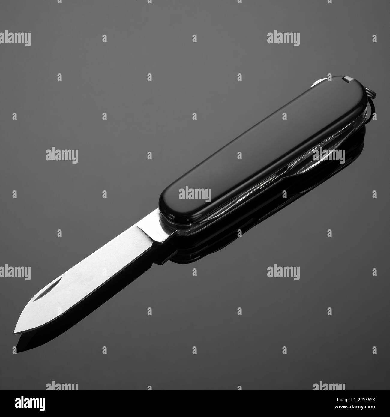 Folding knife on a black background Stock Photo