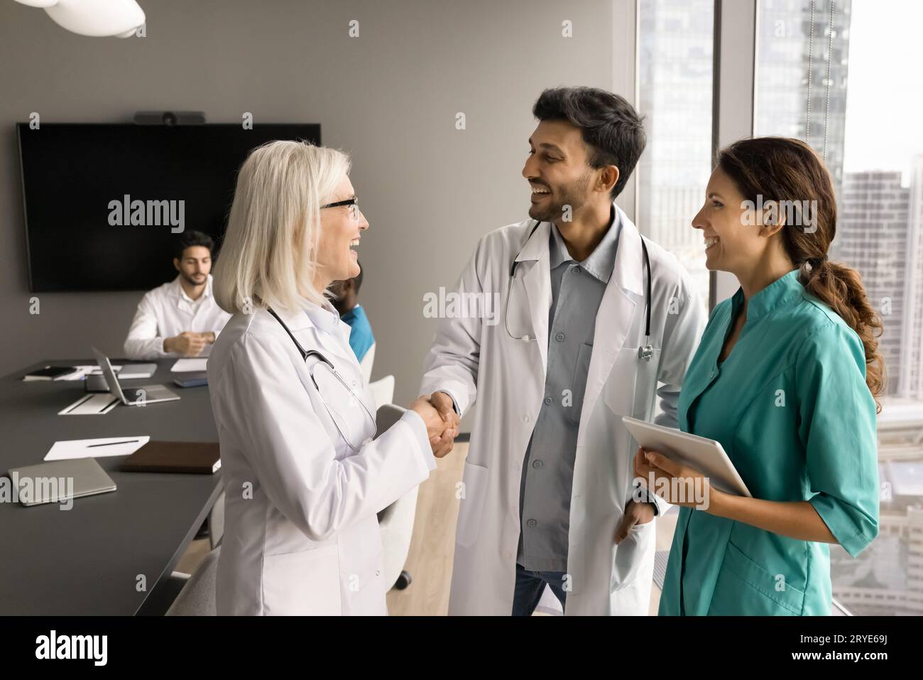 Indian woman doctor shaking hand hi-res stock photography and images ...