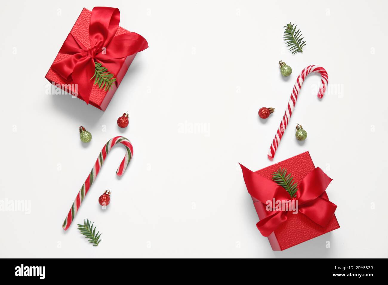 Christmas balls, gift boxes and candy canes on white background Stock ...