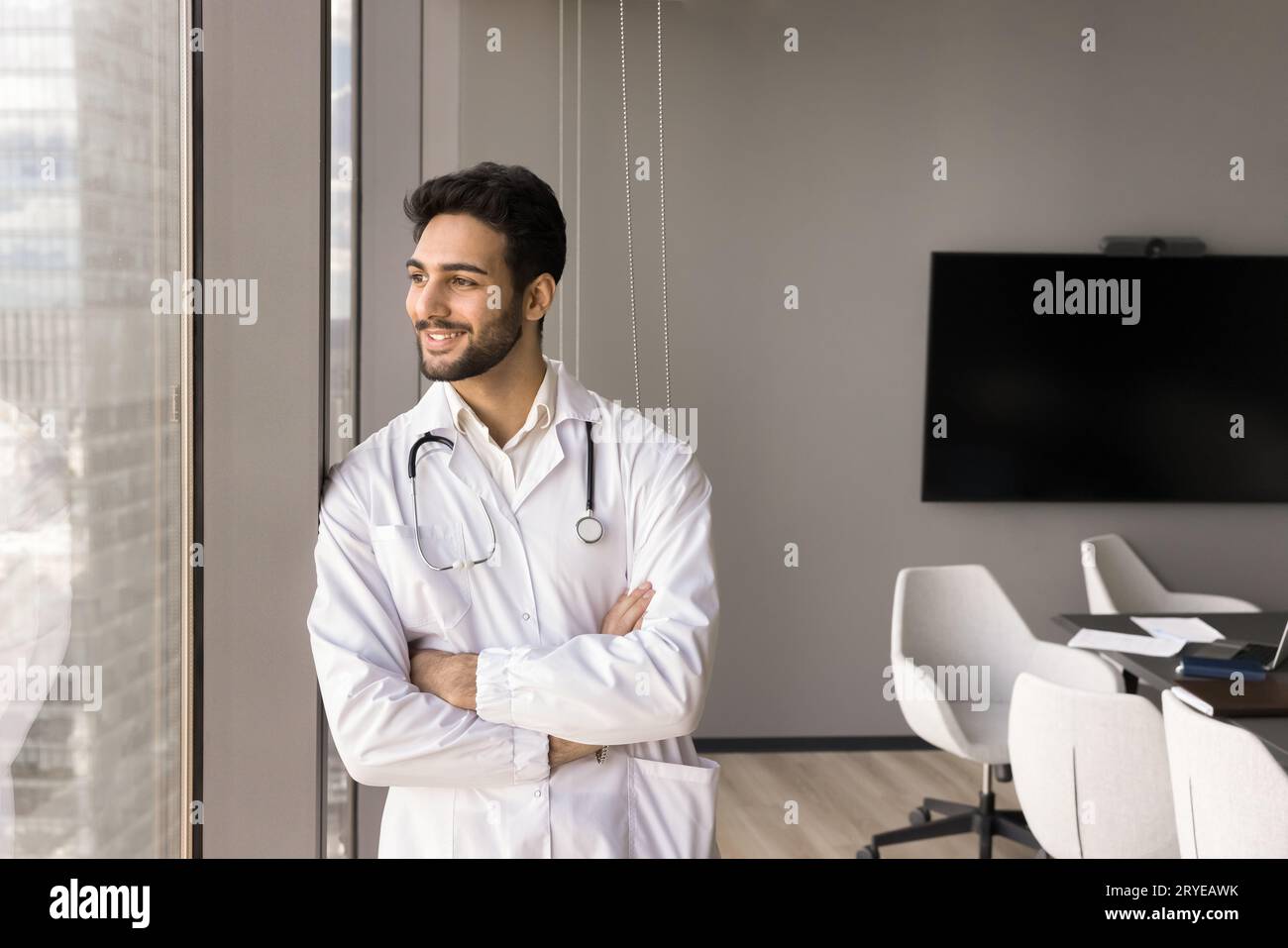 Happy handsome medical professional leader man standing alone Stock Photo
