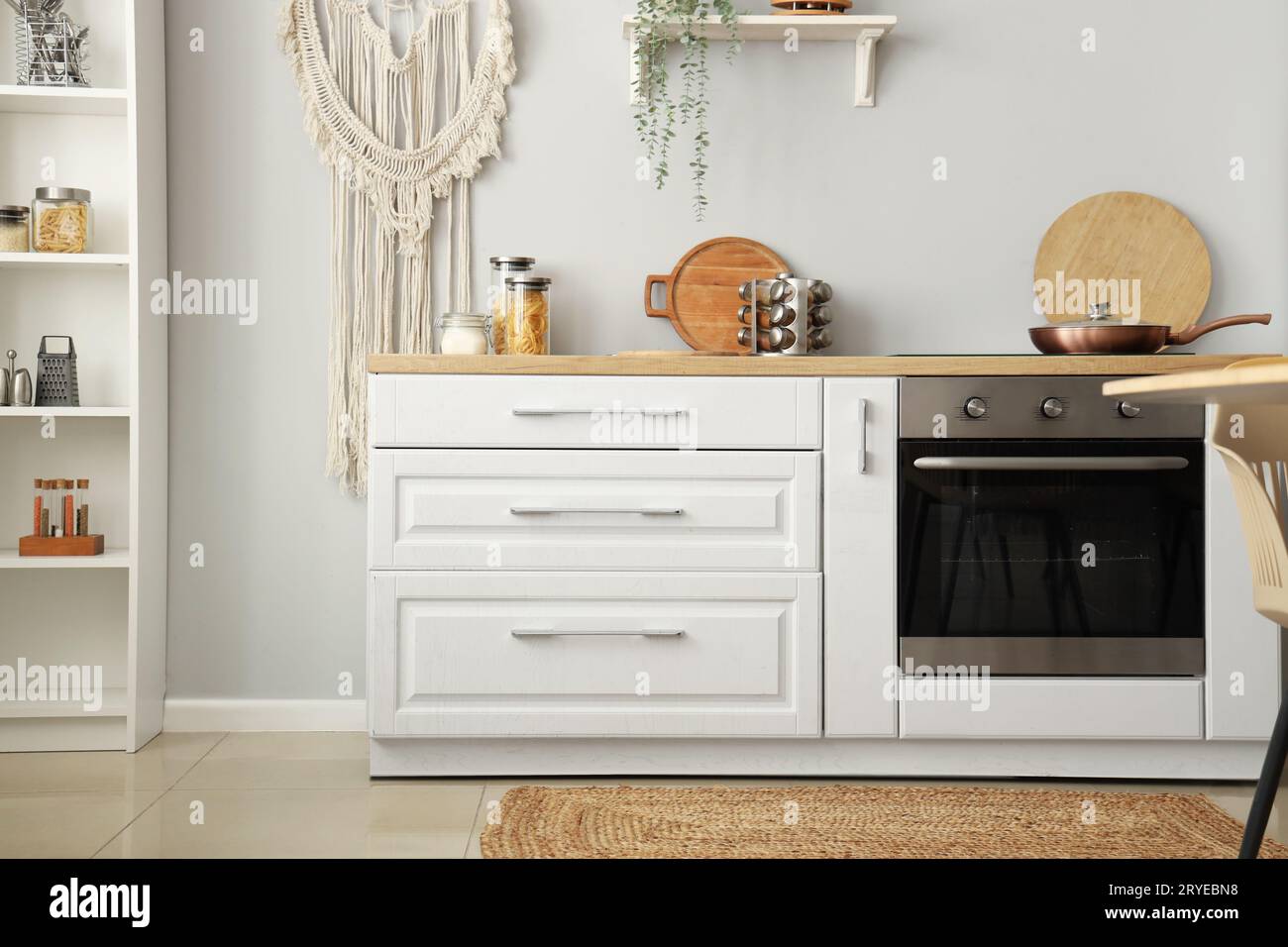 Interior of light kitchen with white counters Stock Photo - Alamy