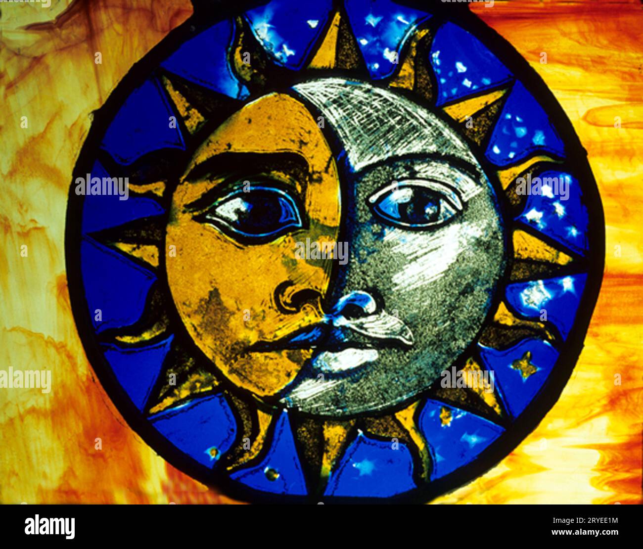 Ely Cathedral, Stained Glass Museum, Sun and Moon, human face ,modern glass, Cambridgeshire, England, UK Stock Photo