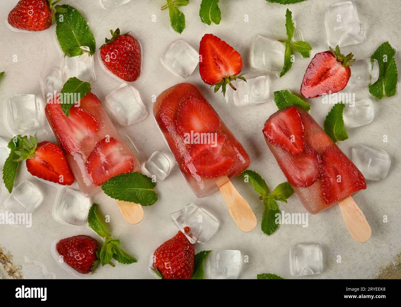 Strawberry ice cream popsicle on table Stock Photo