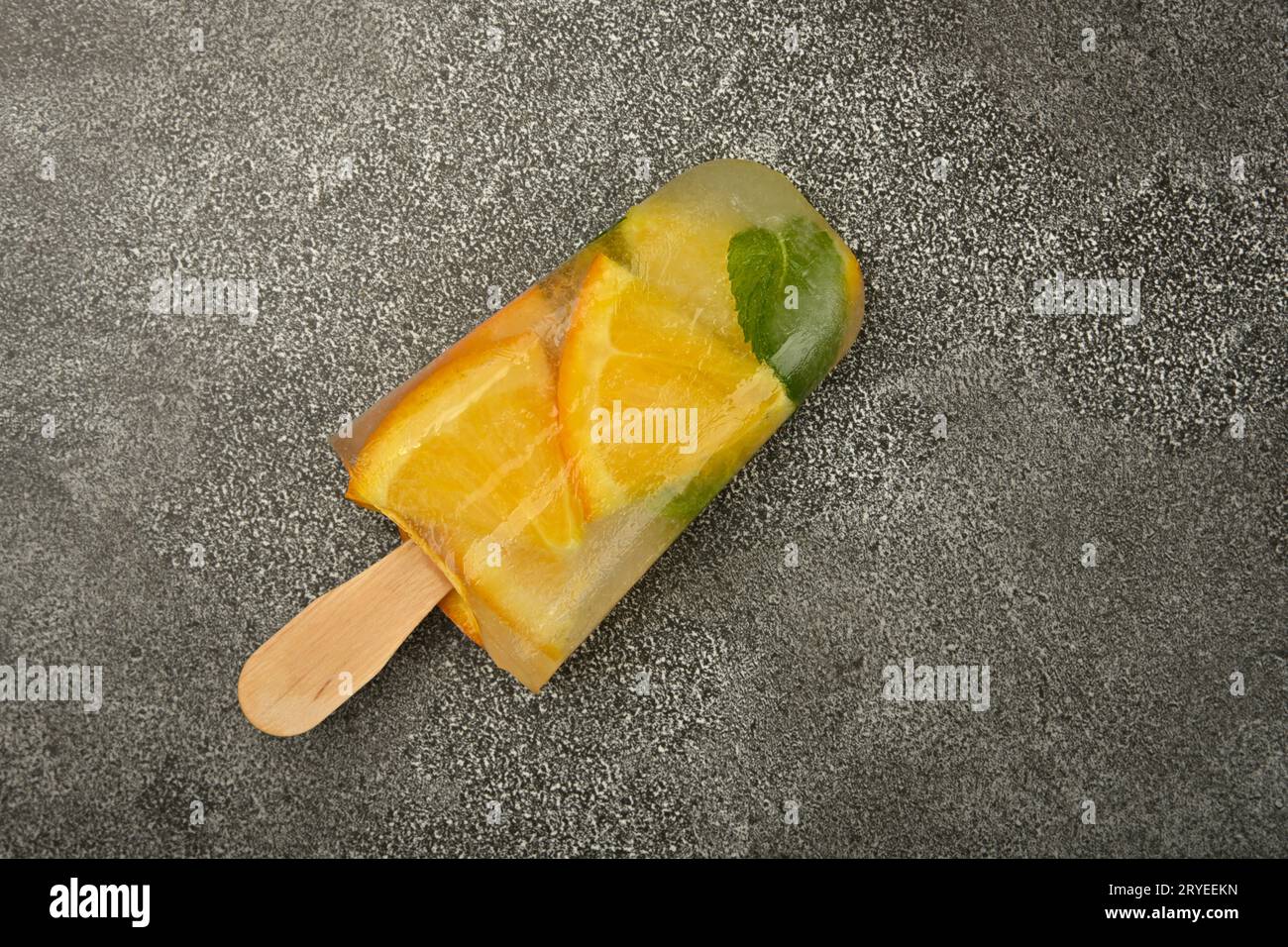 Orange and mint ice cream popsicles on table Stock Photo